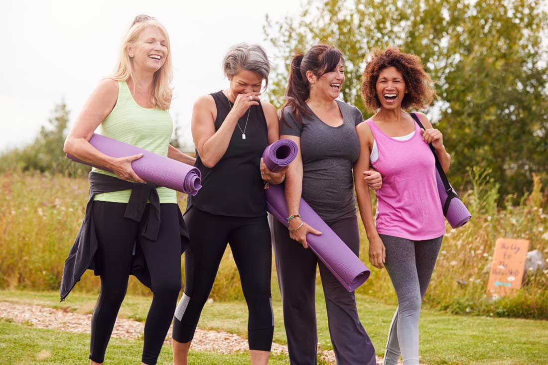 group of women improving well-being by exercising together